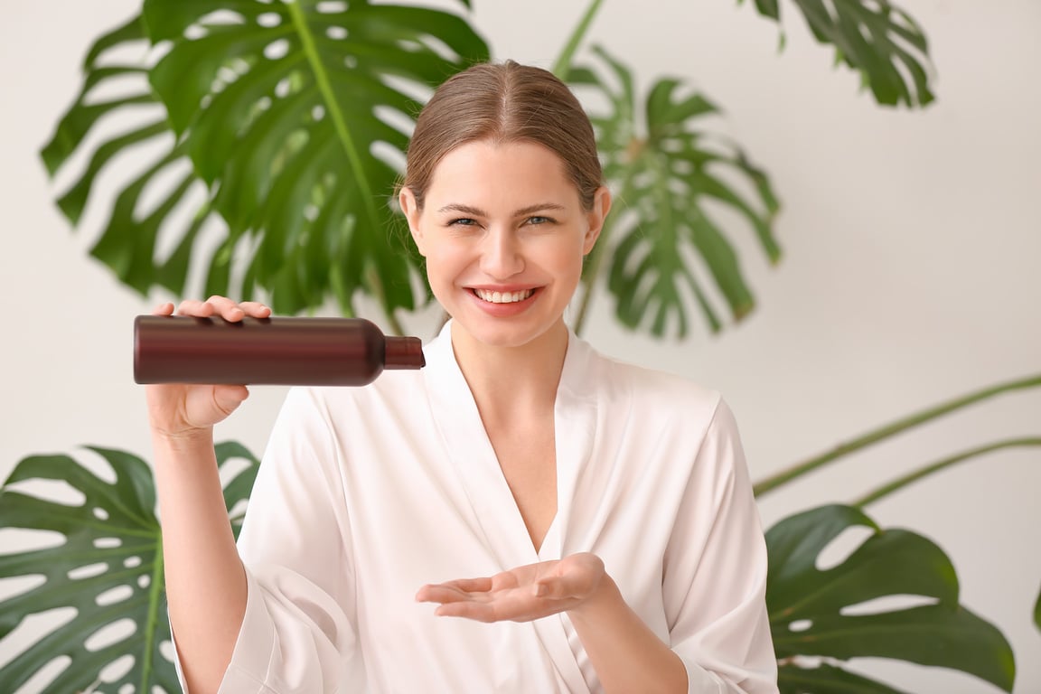 A Female Model Holding a Shower Gel